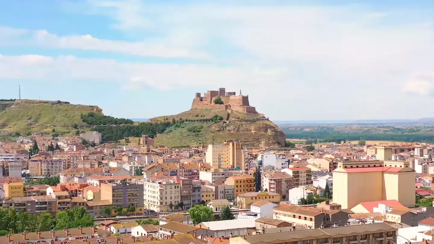Monzón from the air: the castle on its rock above the town